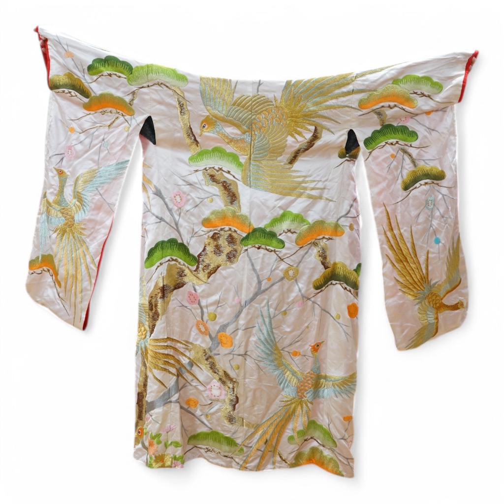 A late 20th century polychrome silk and metallic embroidered Japanese kimono, 133cm long. Condition - the silk is stained in places, which may be able to be cleaned.